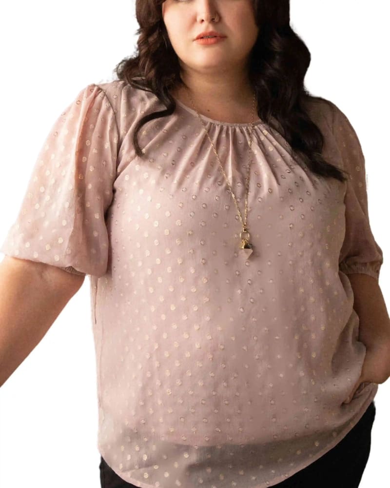 Front of a model wearing a size XL Tessa Top Subtle Textured Lurex Dots Shirring in Pink by ANNICK. | dia_product_style_image_id:295727